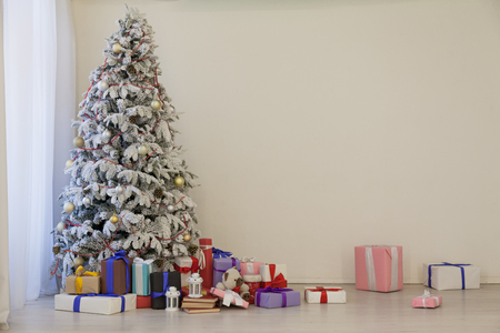 Christmas tree with presents, Garland lights new yearの写真素材