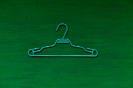 from the wardrobes of clothes hangers on the background of fashionの写真素材