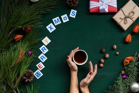 Christmas background new year hands gifts toys balls fruits nutsの写真素材