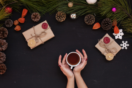 Christmas background new year winter tree gifts nuts bumps handsの写真素材