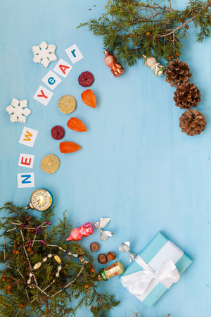 the inscription at the Christmas new year background with Christmas tree and giftsの写真素材