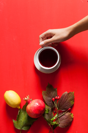 Cup of tea autumn leaves background fruits nutsの写真素材