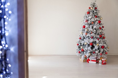 White Christmas tree with red toys new year winter gifts decorの写真素材
