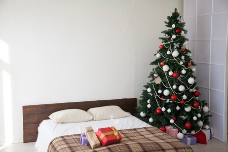 Christmas tree with presents on new years Eve in the Interiorの写真素材