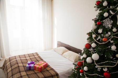 Christmas tree with presents on new years Eve in the Interiorの写真素材