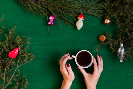 Christmas background hand new year coniferous branches presents winter postcardの写真素材