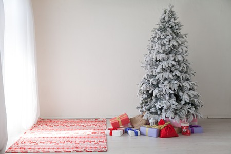 Merry Christmas tree gifts new year House Interiorの写真素材