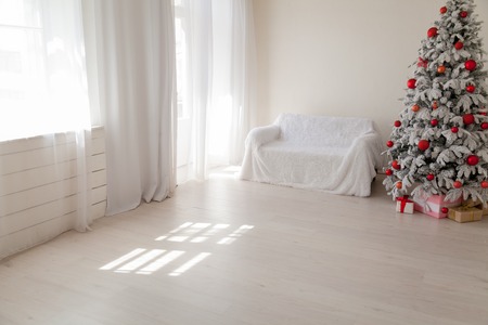 Christmas tree in the white room gifts new yearの写真素材