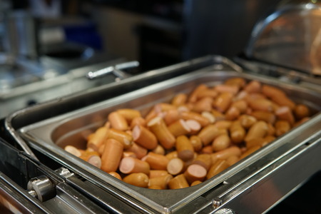 a lot of cooked sausage meat meal for breakfastの写真素材