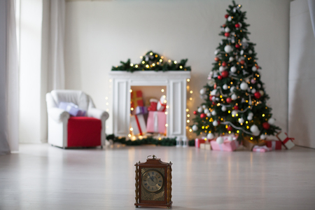 Christmas tree in the Interior of the white room gifts new year holiday Garland lightsの写真素材