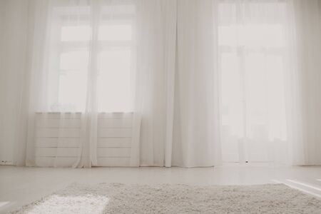 white room with window and door interiorの写真素材