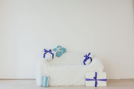 blue gifts on the sofa interior of the white room decor