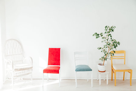 lots of chairs of different colors in the interior of the room