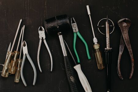 old tools to work and repair against a dark backgroundの写真素材