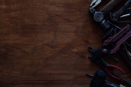 tools to work and repair against a dark backgroundの写真素材