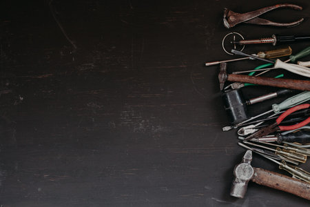 old tools to work and repair against a dark background