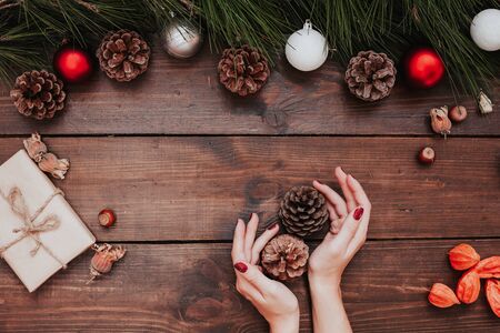 womens hands Christmas new year tree decoration giftsの写真素材
