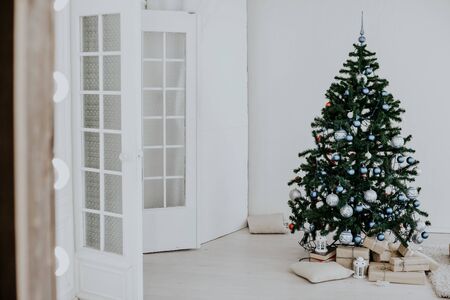 Christmas tree with blue in a white room with toys for Christmas 11の写真素材