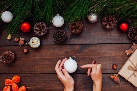 Christmas new year female hands holding Christmas Toysの写真素材