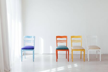 multicolored chairs in the interior of an empty roomの写真素材