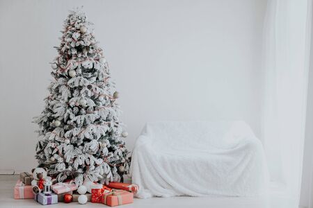 Christmas tree Garland lights new year holiday gifts white homeの写真素材