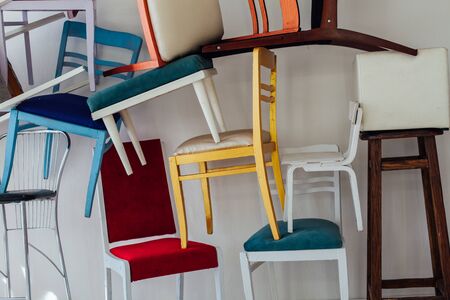 lots of different chairs in the empty white roomの写真素材