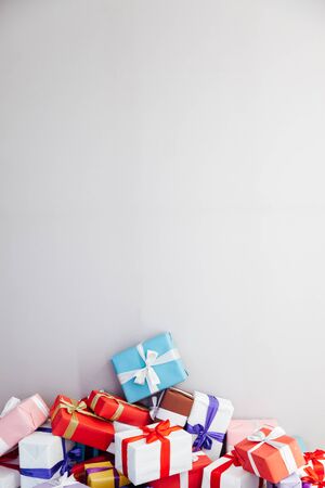 multicolored Christmas birthday presents on a grey backgroundの写真素材