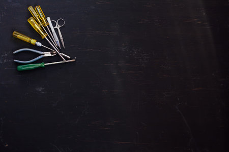 lots of tools to repair work against a dark background