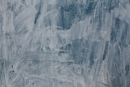 gray background smears paint the texture of the wall