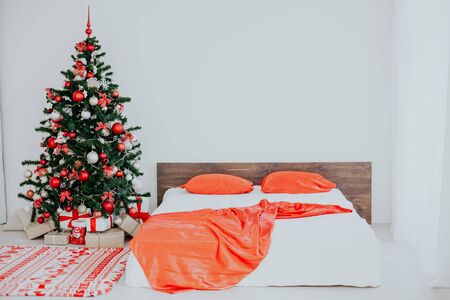 decor white bedroom with Christmas tree Christmas gifts Red 1の写真素材
