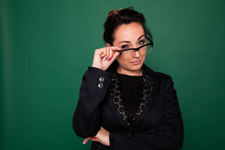 teacher at the green board in class at schoolの写真素材