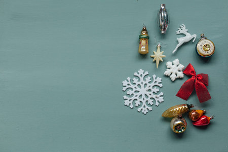 Vintage Christmas tree toys gifts for the new year light green background