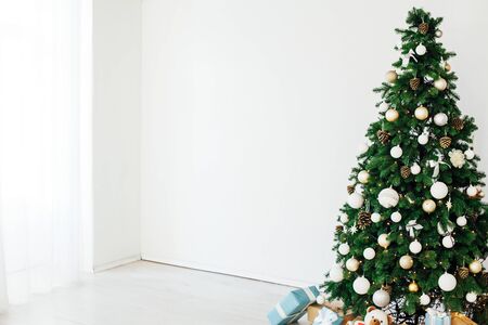 Christmas Tree with gifts of the new year festive interior decorの写真素材