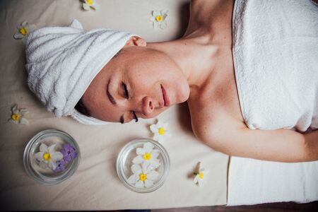 the beautiful girl lying in Spa massage saunaの写真素材