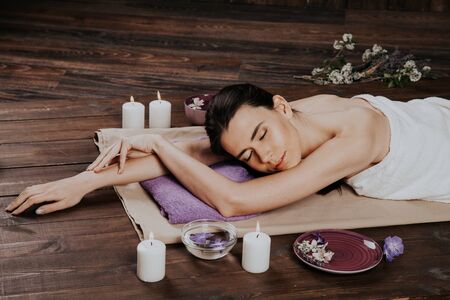girl lies in the sauna before the massage and Spaの写真素材