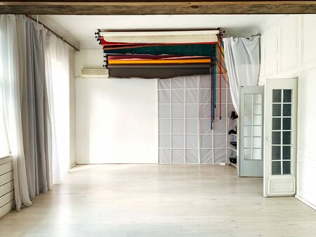 white photo studio with backgrounds accessories of a professional photographerの写真素材