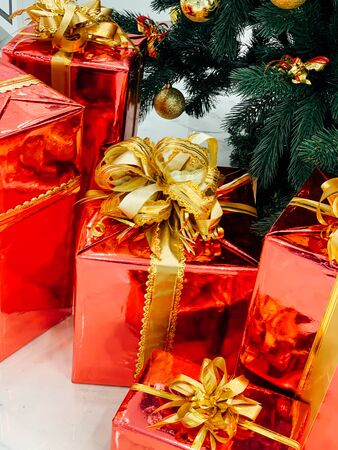red Christmas gifts under the tree for the new yearの写真素材