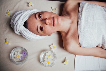 the beautiful girl lying in Spa massage saunaの写真素材