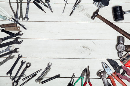 construction hammers screwdriver repair tool pliers on the board