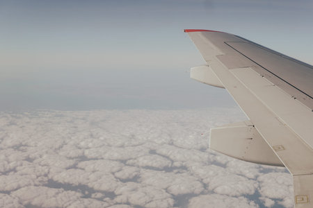 Wing blue sky and clouds in the journey 1