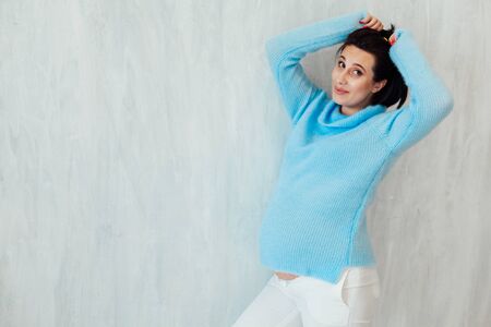 Portrait of a pregnant woman preparing to come babyの写真素材