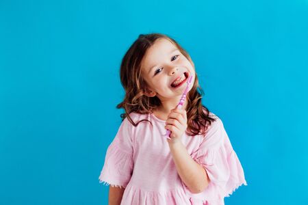 little girl with a toothbrush in dentistry niceの写真素材
