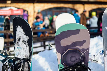 skis and Snowboards on the background of the ski resortの写真素材