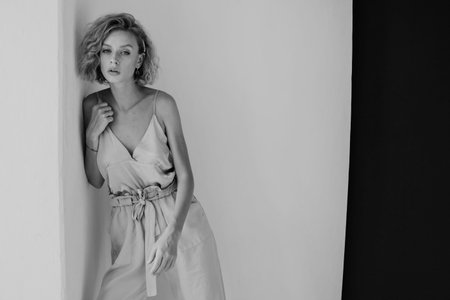 Portrait of a beautiful woman blonde in a fashionable jumpsuit