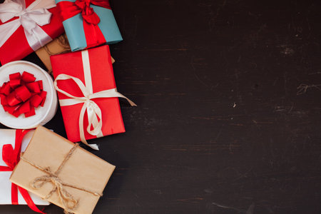 lots of holiday gifts for Christmas New Year's birthday on a dark background