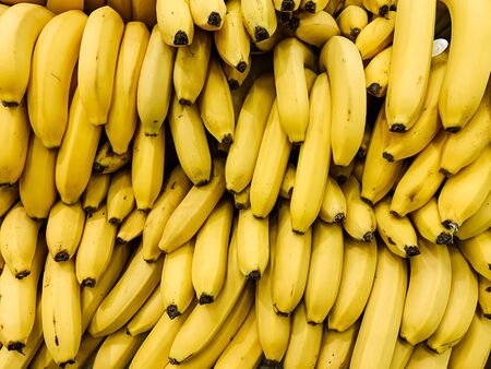 lots of delicious ripe yellow sweet bananas for eating like a backgroundの写真素材