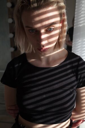 Portrait of a beautiful blonde woman in vintage black clothesの写真素材