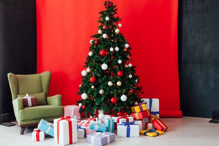 Christmas lights in the room of new year Christmas tree giftsの写真素材