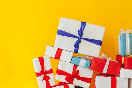 Christmas presents on a yellow backgroundの写真素材