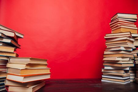 library of many different books on a red backgroundの写真素材